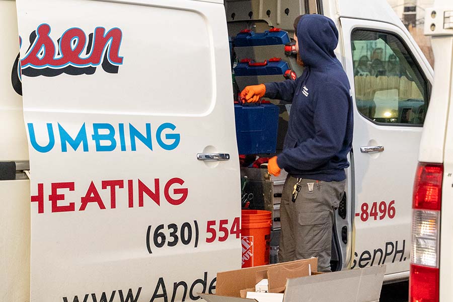 Technician organizing tools in van