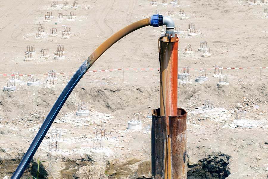 Groundwater extraction system with a corroded pipe and hose