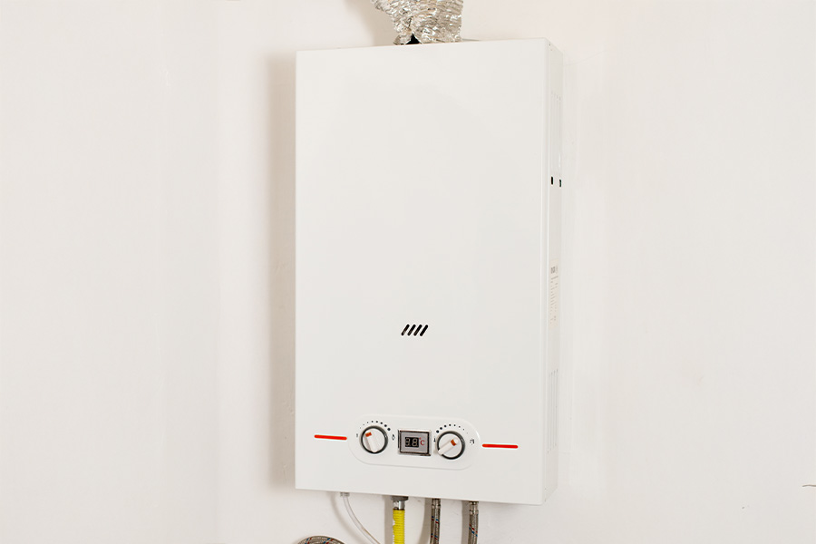 Wall-mounted tankless water heater with temperature controls