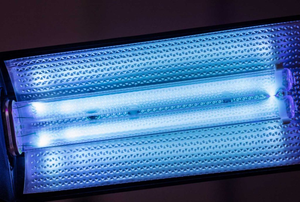Blue glowing ultraviolet light with a detailed, textured reflector