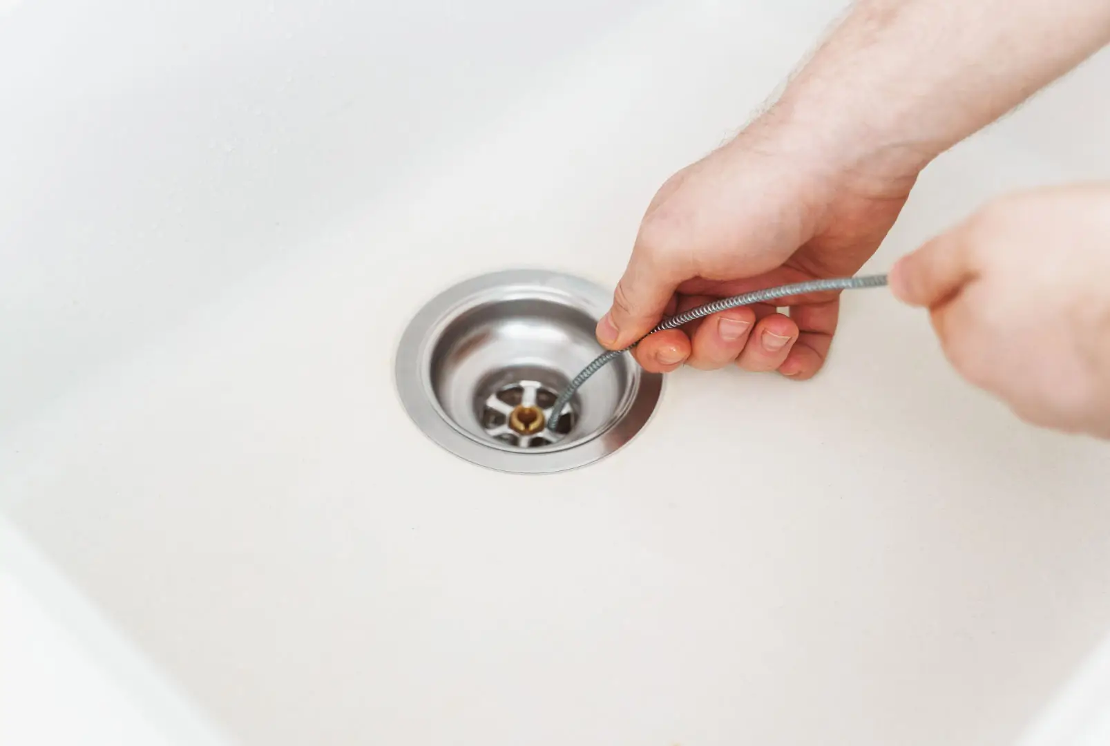 Hand snaking kitchen drain
