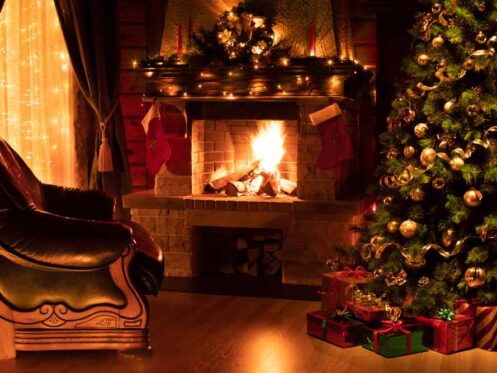 View of a cozy fireplace during the holiday season
