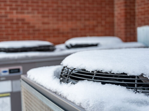 snow-covered HVAC outdoor unit Oswego, IL