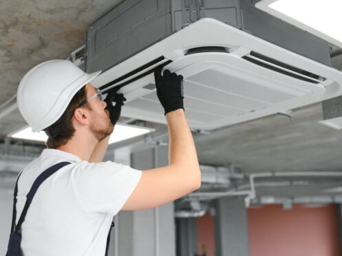 Andersen Plumbing and Heating technician inspecting a heating system